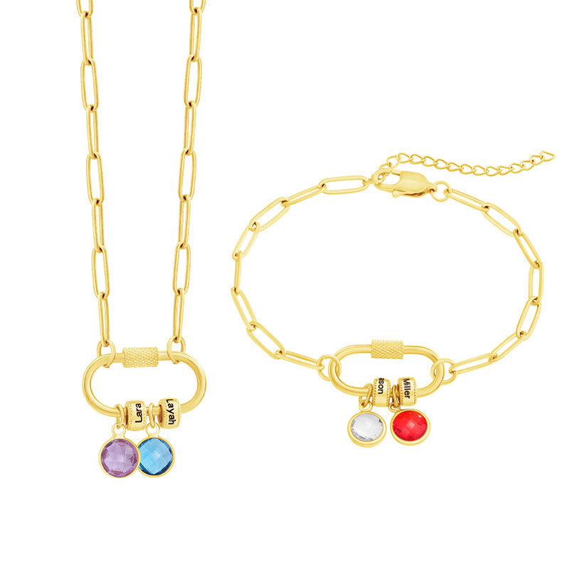 A two-part jewelry set with a pendant and a bracelet, featuring colorful gemstones and metallic clasps, displayed on a surface with pink crystals.