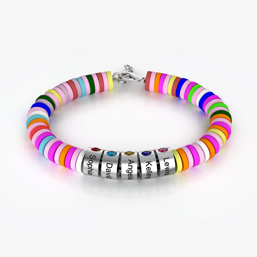 A multicolored beaded bracelet with silver accents and personalized lettering.