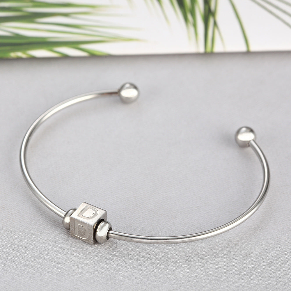 Adjustable silver bangle with alphabet cube charms – custom design