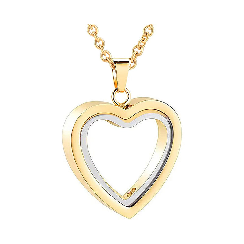 Gold and silver heart-shaped pendant on a white background