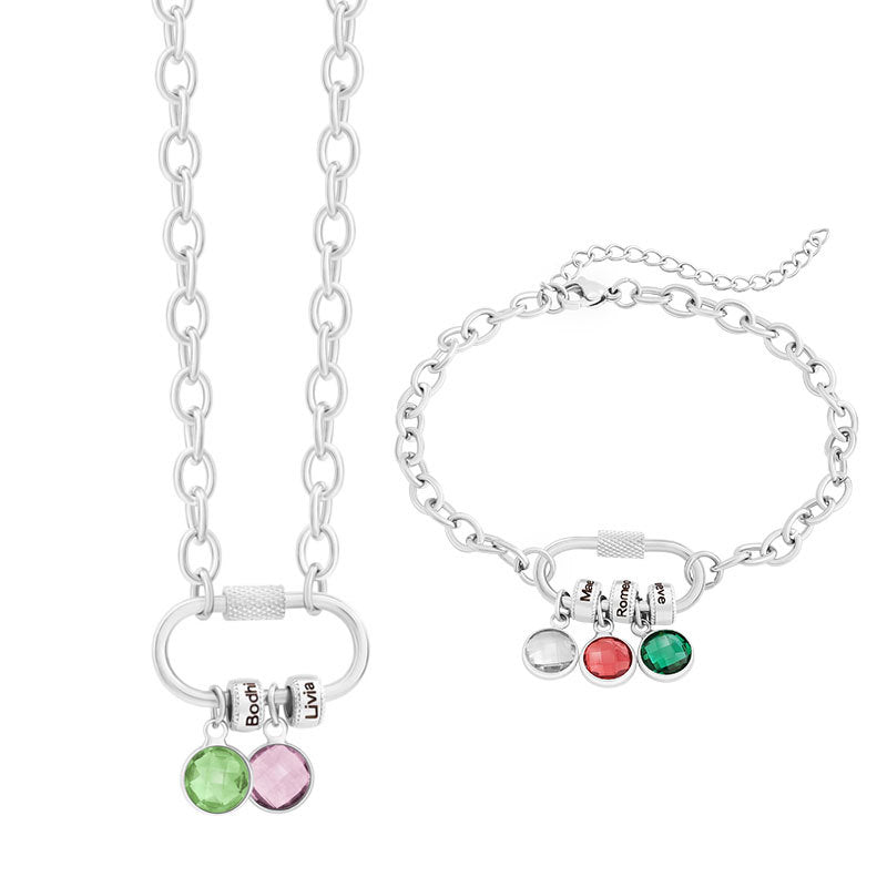 A two-part jewelry set with a pendant and a bracelet, featuring colorful gemstones and metallic clasps, displayed on a surface with pink crystals.