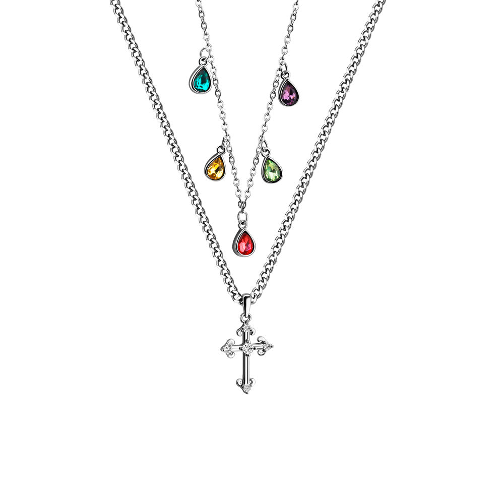 A silver-colored necklace featuring a double chain design with a cross pendant and multicolored gemstone accents.